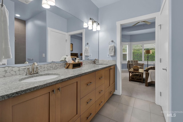 bathroom featuring vanity, tile patterned floors, and ceiling fan