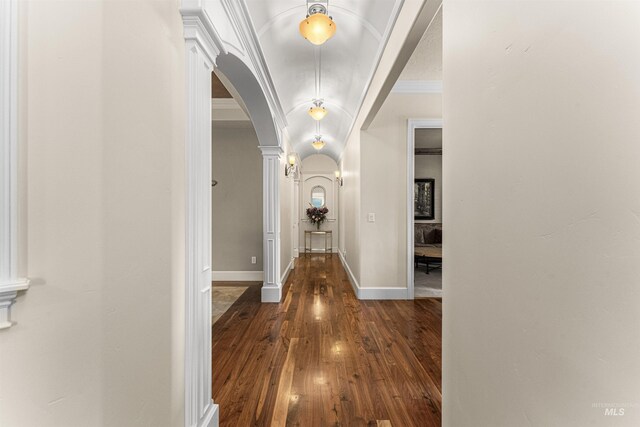 1137 N Cobblestone Way, Eagle, ID 83616 - foyer with arched walkways, dark wood-style flooring, ornate columns, baseboards, and ornamental molding
