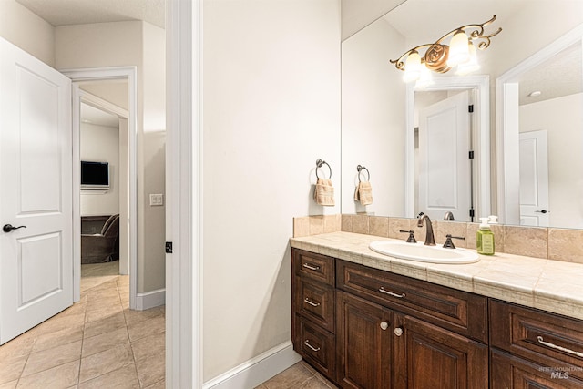 1137 N Cobblestone Way, Eagle, ID 83616 - bathroom with tile patterned flooring, vanity, and baseboards