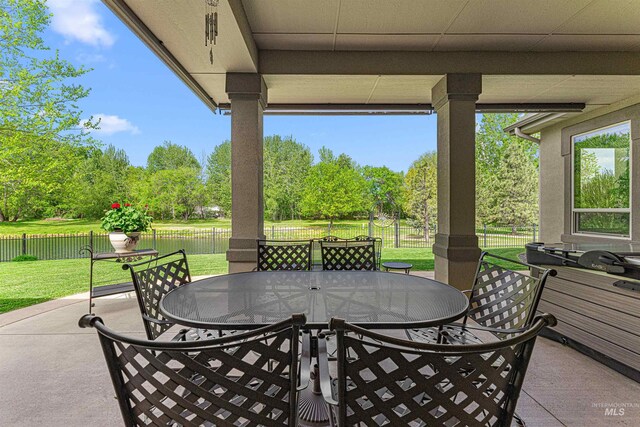 1137 N Cobblestone Way, Eagle, ID 83616 - view of patio / terrace with outdoor dining area and view of scattered trees