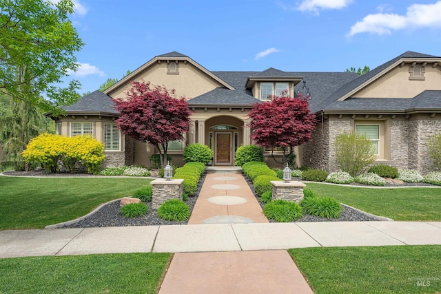1137 N Cobblestone Way, Eagle, ID 83616 - view of front facade with stone siding, a front lawn, and stucco siding
