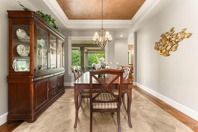 1137 N Cobblestone Way, Eagle, ID 83616 - dining space with a tray ceiling, a chandelier, ornamental molding, and baseboards