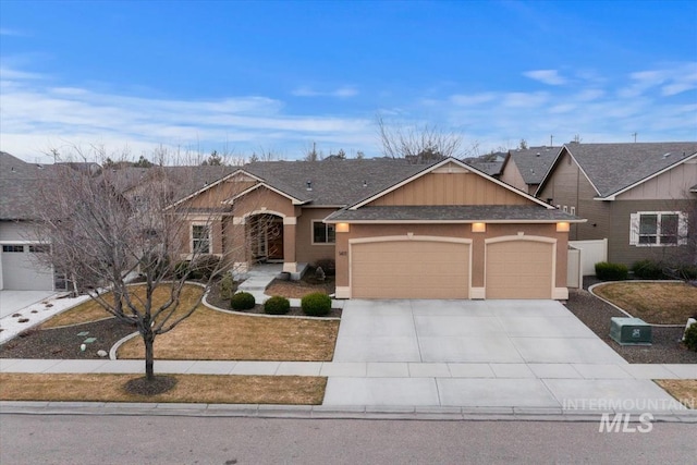 view of front facade featuring a garage, stucco siding, driveway, and a shingled roof