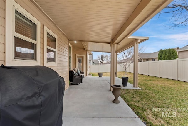 view of patio / terrace with grilling area and a fenced backyard