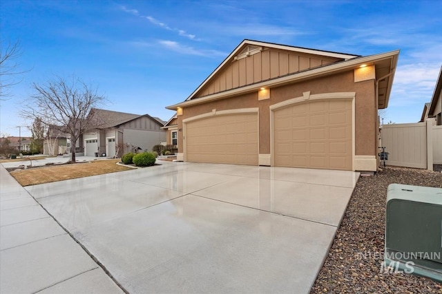 single story home with stucco siding, board and batten siding, concrete driveway, and a garage