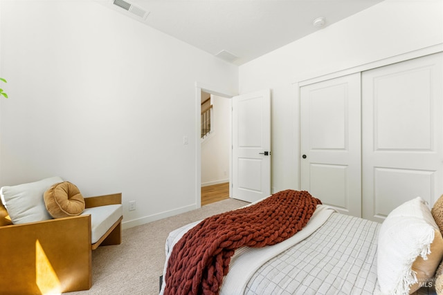 carpeted bedroom with a closet