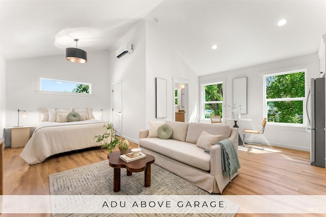 bedroom featuring light hardwood / wood-style floors, a wall mounted AC, multiple windows, and stainless steel fridge