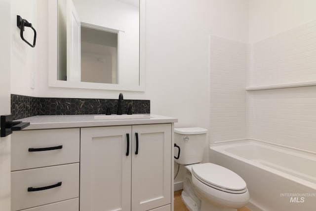 full bathroom featuring vanity, shower / bathtub combination, and toilet