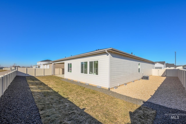 view of side of home featuring a lawn and central air condition unit