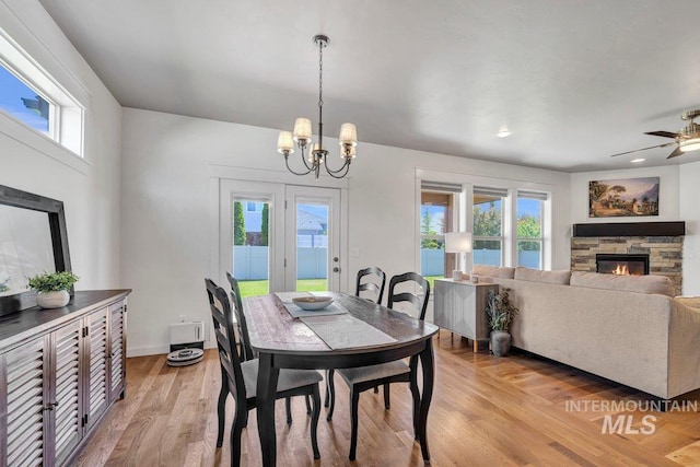 633 Reese Rd, Twin Falls, ID 83301 - dining space featuring a fireplace, plenty of natural light, and light wood-style floors