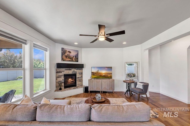 633 Reese Rd, Twin Falls, ID 83301 - living room with plenty of natural light, a fireplace, ceiling fan, recessed lighting, and wood finished floors