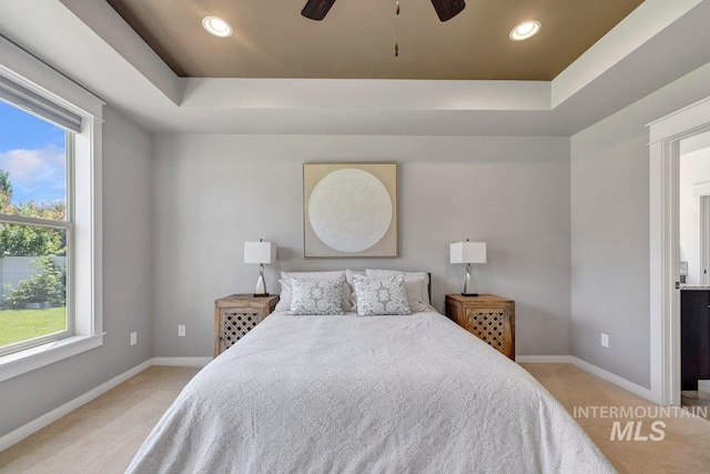 633 Reese Rd, Twin Falls, ID 83301 - bedroom featuring carpet floors, a tray ceiling, recessed lighting, and a ceiling fan