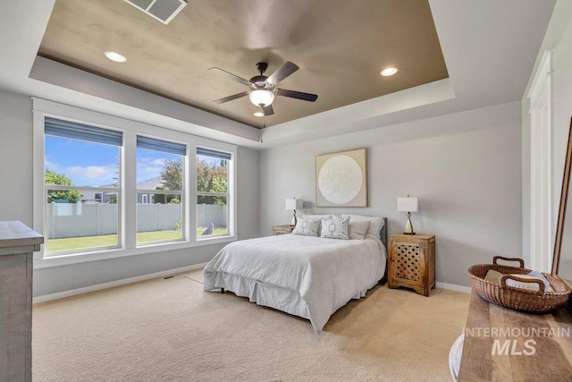 633 Reese Rd, Twin Falls, ID 83301 - bedroom featuring a tray ceiling, light carpet, recessed lighting, and a ceiling fan