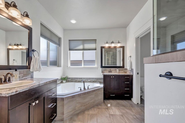 633 Reese Rd, Twin Falls, ID 83301 - full bath featuring two vanities, a garden tub, and marble finish floors