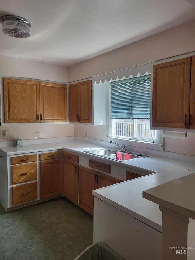 240 N D St, Orofino, ID 83544 - kitchen with brown cabinets, light countertops, and a sink