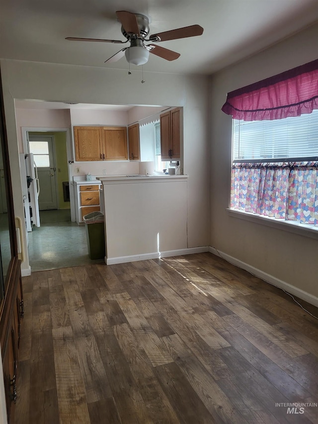 240 N D St, Orofino, ID 83544 - interior space featuring ceiling fan, baseboards, and dark wood finished floors