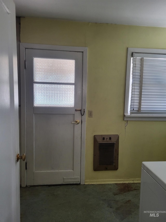 240 N D St, Orofino, ID 83544 - entryway featuring concrete floors, washer / dryer, and heating unit