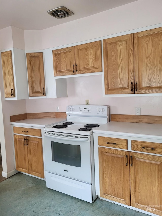 240 N D St, Orofino, ID 83544 - kitchen featuring visible vents, light countertops, and electric range
