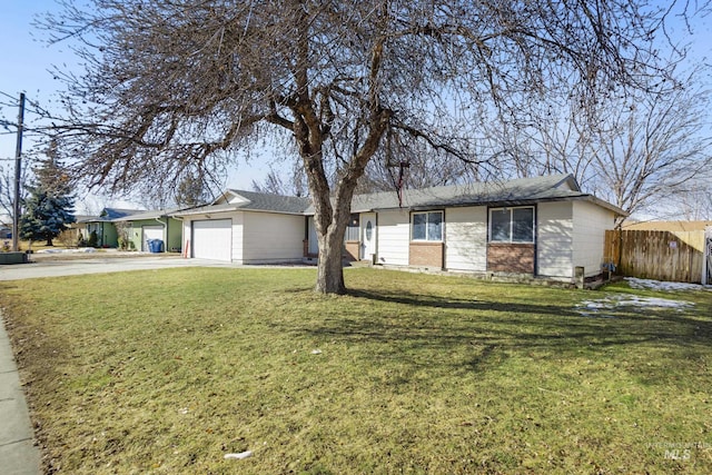 ranch-style house featuring a garage, driveway, fence, and a front yard