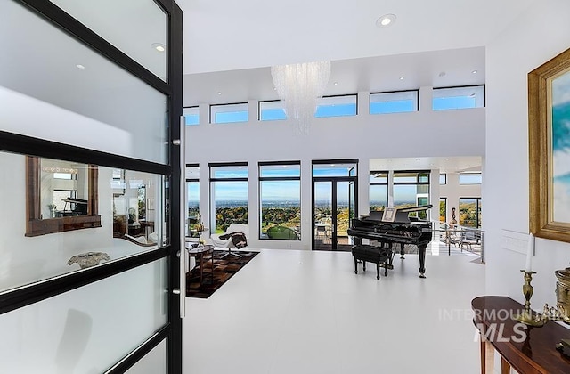 interior space with french doors and a high ceiling