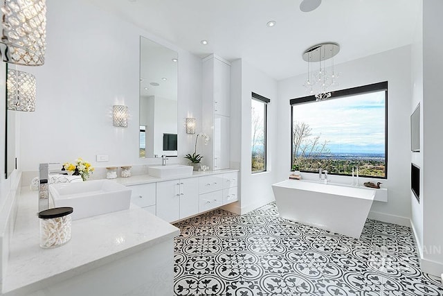 bathroom with a bath and vanity