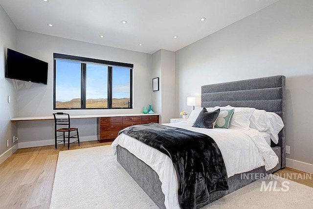 bedroom with light hardwood / wood-style flooring