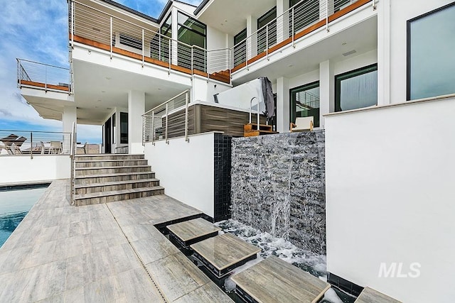 view of patio with a pool