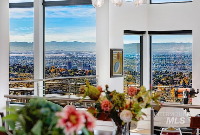 interior space featuring a mountain view and an inviting chandelier