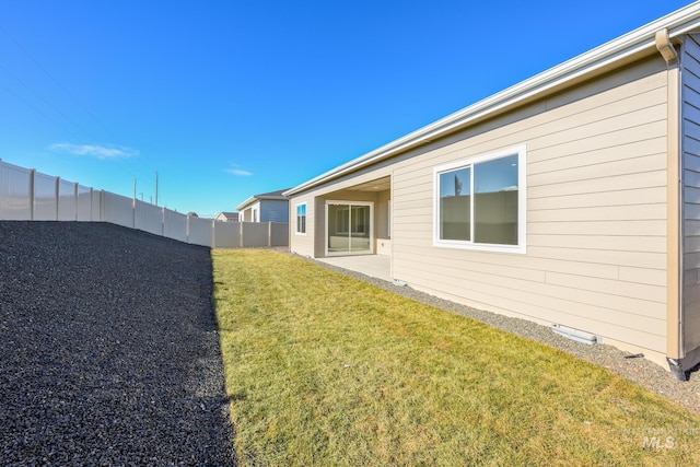 view of yard with a fenced backyard