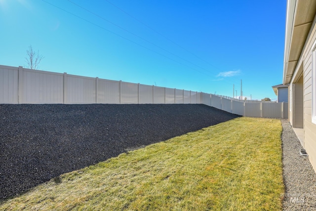 view of yard with a fenced backyard