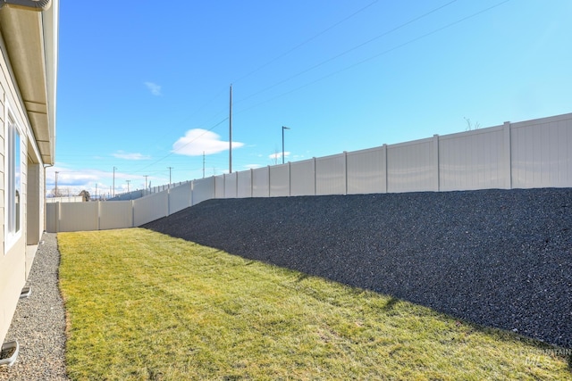 view of yard featuring a fenced backyard