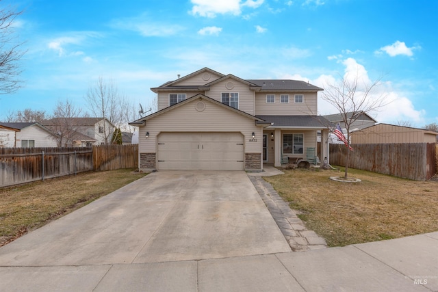 traditional home featuring stone siding, driveway, a front lawn, and fence