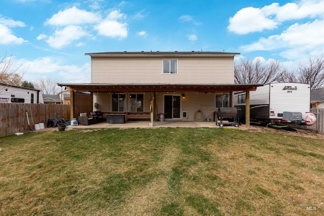 back of house featuring a patio area, central air condition unit, a yard, and fence