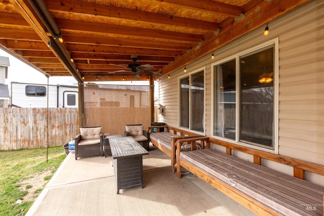 view of patio with a ceiling fan, fence, and an outdoor hangout area