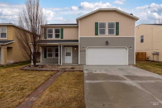 view of front of house featuring a garage and a front lawn