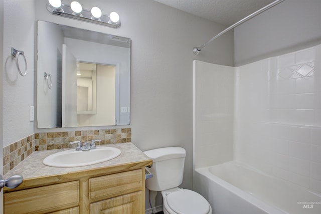 full bathroom with vanity, bathtub / shower combination, backsplash, and toilet