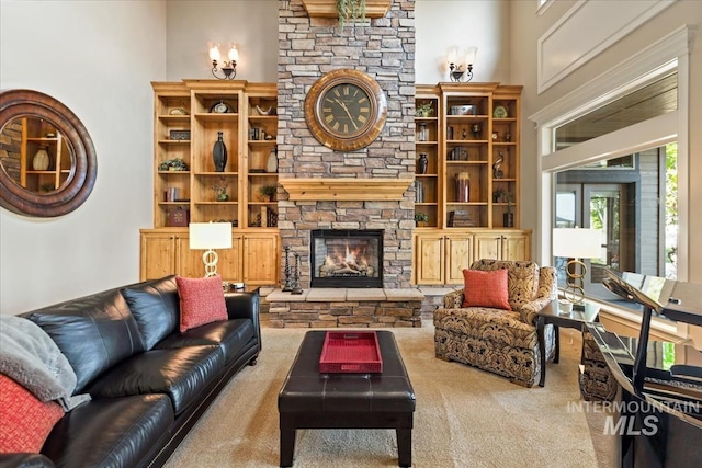 7406 Wild Horse Way, Nampa, ID 83686 - living room with a high ceiling, a stone fireplace, and carpet