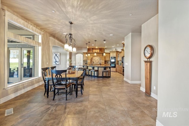 7406 Wild Horse Way, Nampa, ID 83686 - dining space with recessed lighting, baseboards, visible vents, and french doors