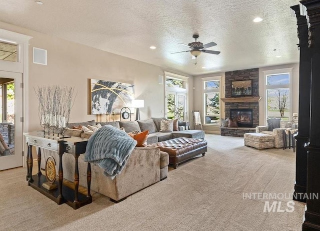 7406 Wild Horse Way, Nampa, ID 83686 - living area featuring a healthy amount of sunlight, carpet, a ceiling fan, and a textured ceiling