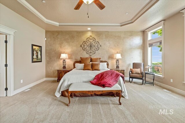 7406 Wild Horse Way, Nampa, ID 83686 - carpeted bedroom featuring ornamental molding, baseboards, a textured ceiling, a raised ceiling, and a ceiling fan