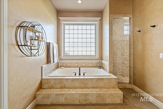 7406 Wild Horse Way, Nampa, ID 83686 - full bathroom with baseboards, a tile shower, and a garden tub