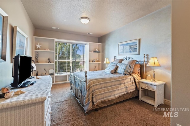 7406 Wild Horse Way, Nampa, ID 83686 - bedroom with carpet flooring and a textured ceiling