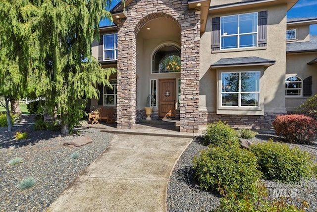 7406 Wild Horse Way, Nampa, ID 83686 - view of exterior entry featuring stone siding and stucco siding