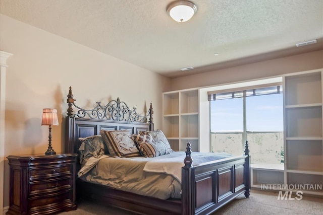 7406 Wild Horse Way, Nampa, ID 83686 - carpeted bedroom with visible vents and a textured ceiling