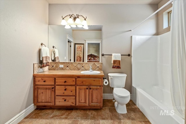 7406 Wild Horse Way, Nampa, ID 83686 - full bathroom with vanity, bathing tub / shower combination, toilet, baseboards, and backsplash