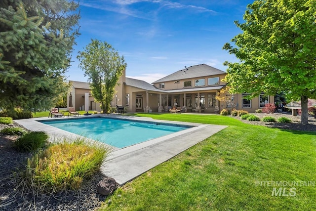 7406 Wild Horse Way, Nampa, ID 83686 - outdoor pool featuring a lawn
