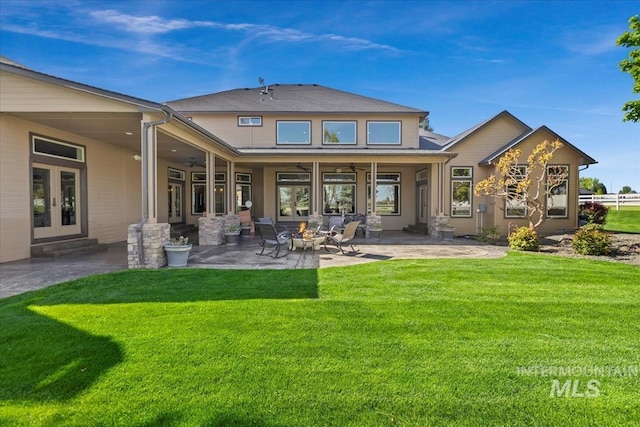 7406 Wild Horse Way, Nampa, ID 83686 - rear view of house with a ceiling fan, french doors, a lawn, a patio, and a fire pit