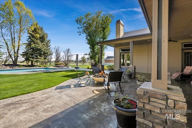 7406 Wild Horse Way, Nampa, ID 83686 - view of patio / terrace with ceiling fan, a fire pit, and an outdoor pool