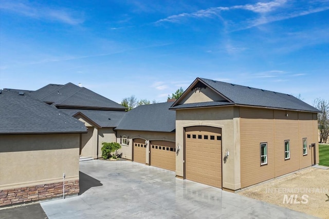 7406 Wild Horse Way, Nampa, ID 83686 - ranch-style house with a garage, stucco siding, driveway, and a shingled roof