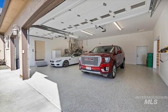 7406 Wild Horse Way, Nampa, ID 83686 - garage featuring a garage door opener